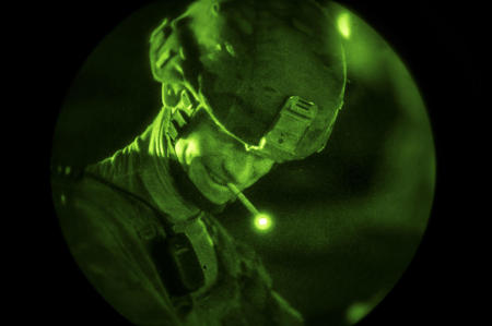 During a nighttime mission, a US Army solder takes a moment to smoke a cigarette.
Published by National Geographic.
