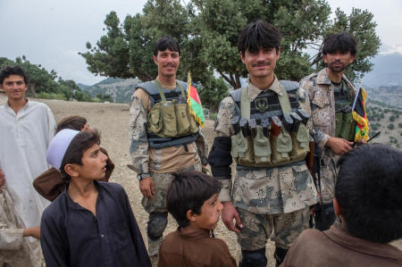 Members of the Afghan Border Police share a laugh with local children during a patrol in eastern Afghanistan. ABP officers patrol a 55 km-wide corridor along the entirety of Afghanistan's border, secure international airports, administer immigration services, and handle anti-narcotic efforts.
Published by Business Insider.