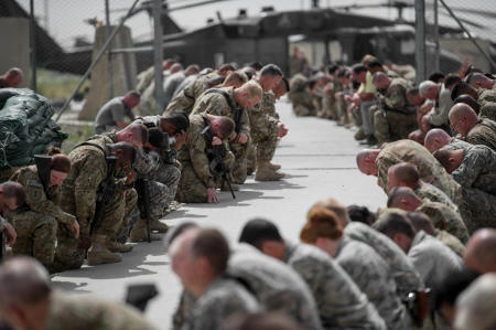 When the prayer was done, the soldiers arose. Eight soldiers dressed in black shorts and white shirts, indicating that they were wounded warriors, approached the helicopter. Individually, they stood in front of their fallen brother, and saluted him.
Published by National Geographic.