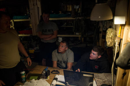 Sabari District, Afghanistan 1st Lt. Matthew Vitellaro (far right), a platoon leader assigned to the U.S. Armys 1st Battalion, 26th Infantry Regiment, 3rd Brigade Combat Team, 1st Infantry Division reviews mission details with members of Charlie Company, 1-26, in eastern Afghanistan. 
Published by National Geographic.